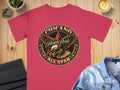 Crimson t-shirt with a circular brown pride eagle graphic and text.