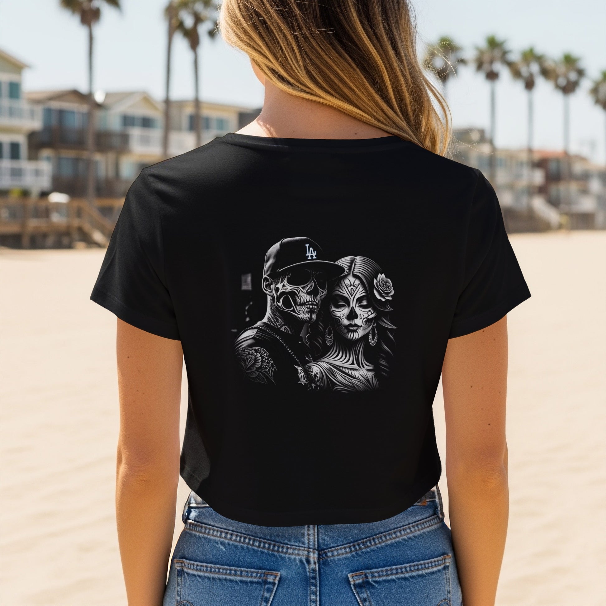 Black t-shirt with Dia de los Muertos couple graphic on back.
