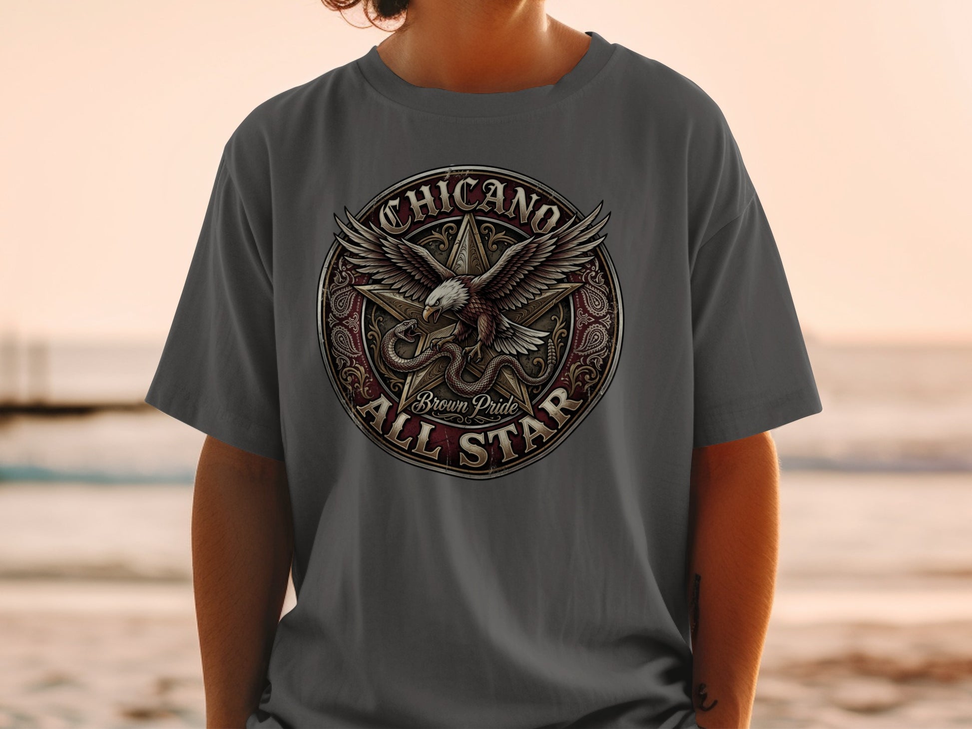 Chicano All Star Brown Pride eagle and snake emblem on grey t-shirt.