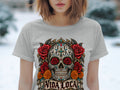 Grey t-shirt with a colorful sugar skull graphic surrounded by roses and marigolds with 