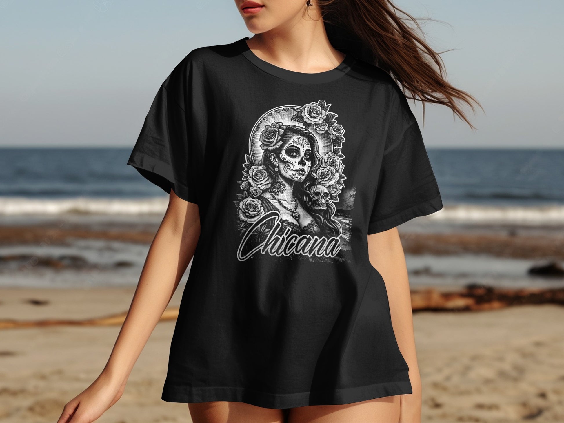 Black t-shirt with "Chicana" text and a skull with roses design.
