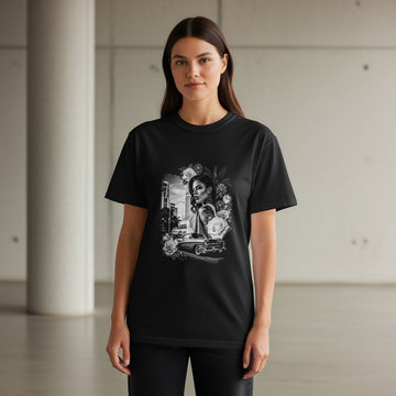 Black t-shirt with graphic of a woman and vintage car surrounded by flowers.