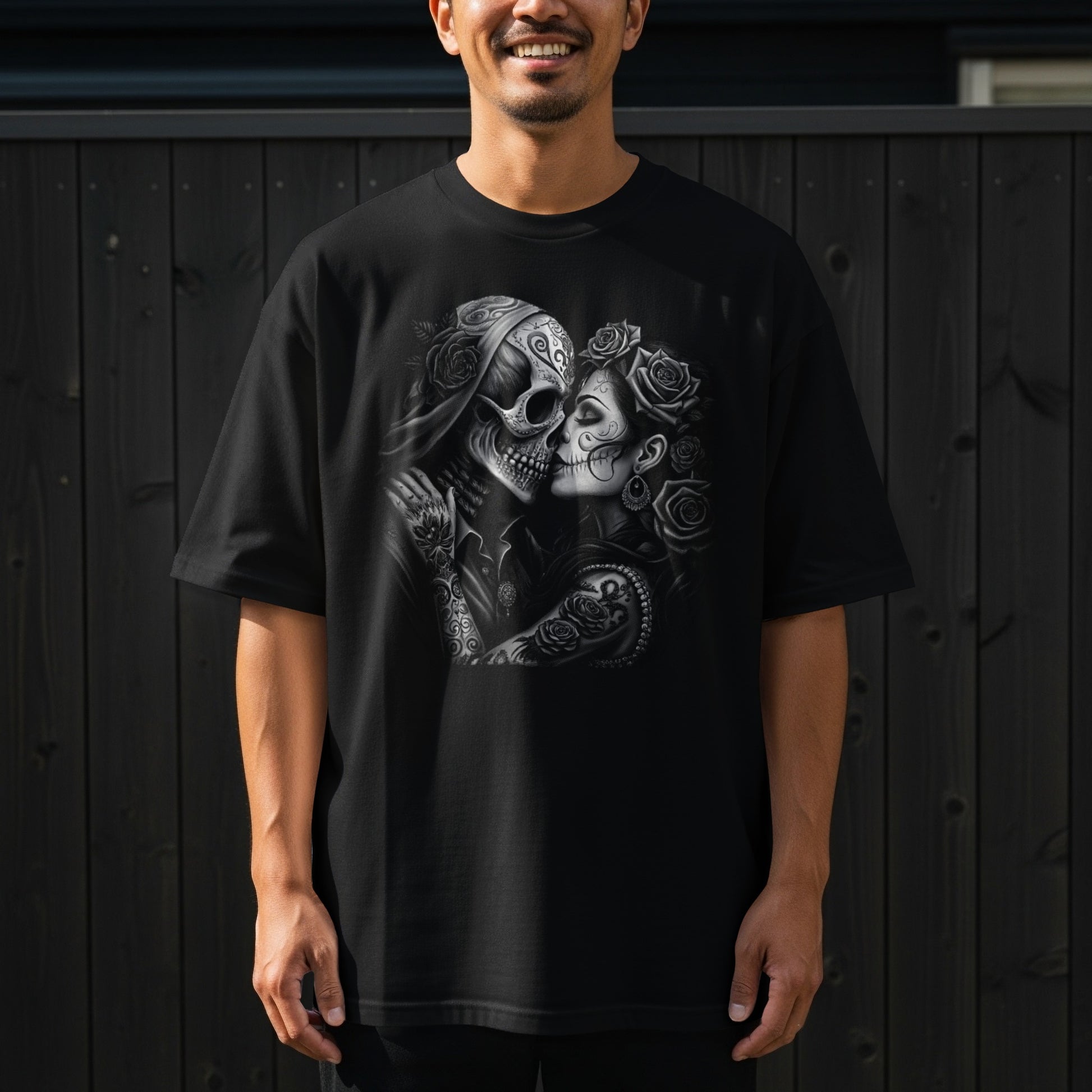 Black t-shirt with skull couple embracing, decorated with roses and tattoos.
