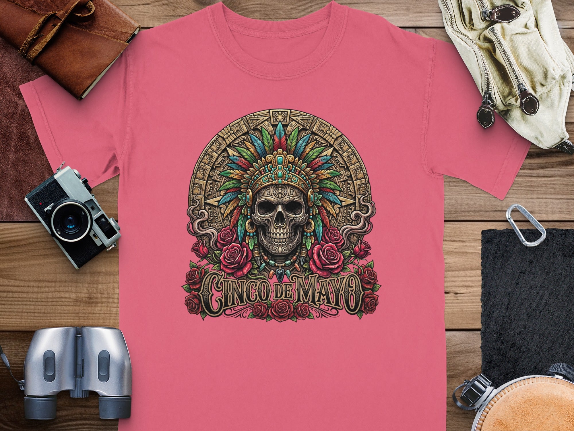 Pink t-shirt with a skull in a headdress and "Cinco de Mayo" text.
