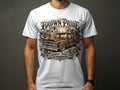 T-shirt with graphic of brown lowrider truck and text 