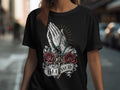 Black t-shirt with praying hands, rosary, roses, cross, and 