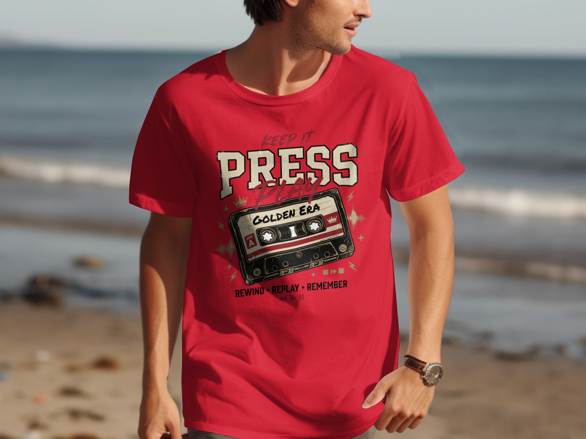 Red t-shirt with "Keep It Press Play Golden Era" and a cassette tape graphic.
