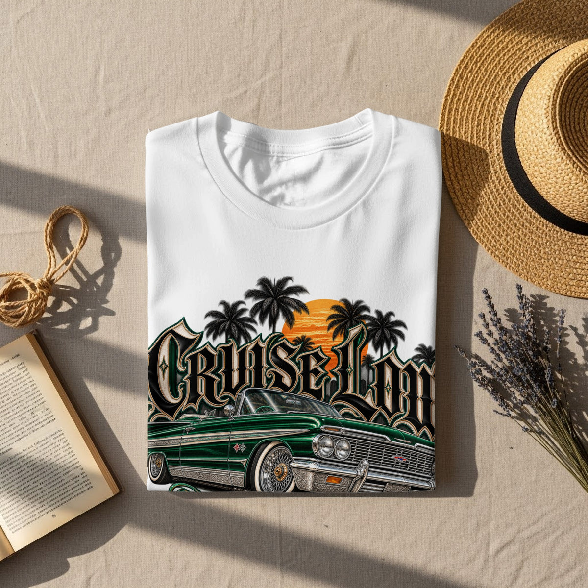 White t-shirt with green lowrider, palm trees, and sunset graphic.