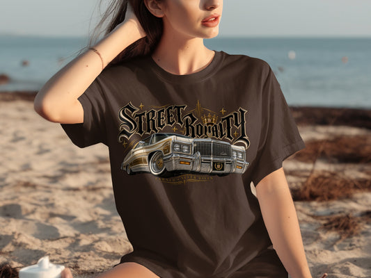 Brown t-shirt with "Street Royalty" text and a classic gold Cadillac on the beach.