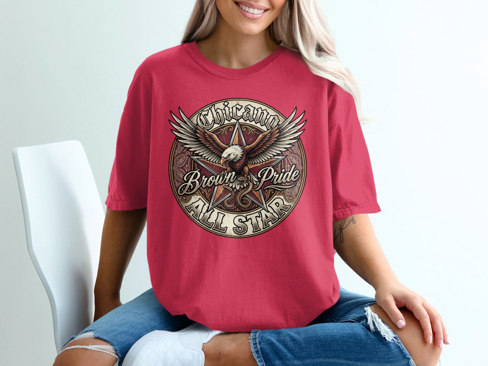 Red t-shirt with "Chicano Brown Pride All Star" and eagle graphic.