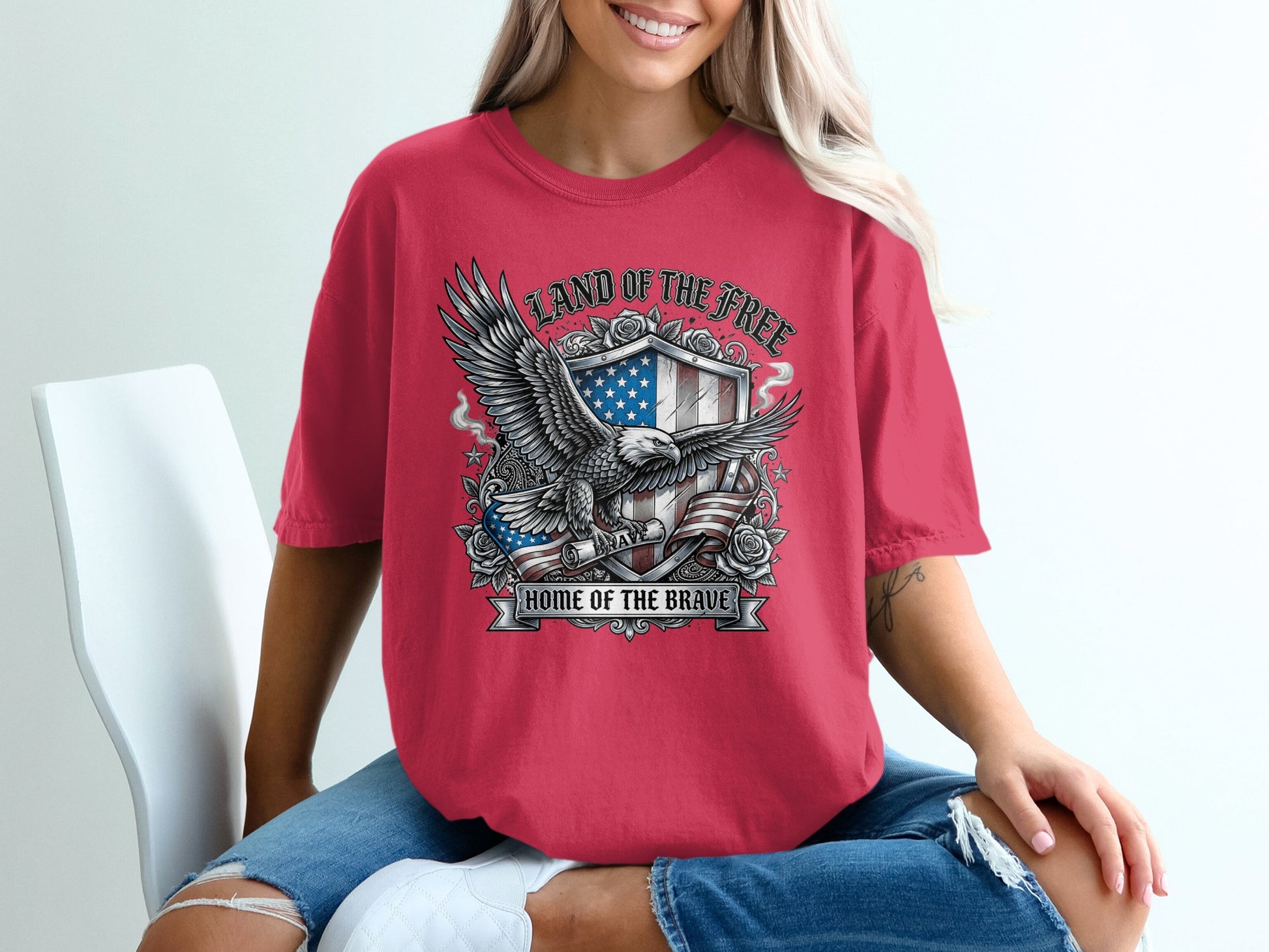 Eagle and shield with "Land of the Free Home of the Brave" text.