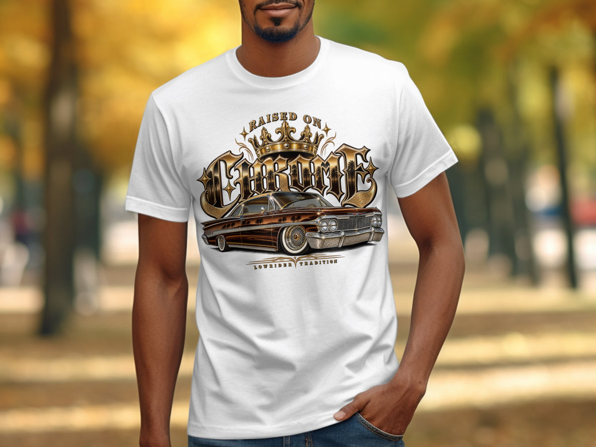 White t-shirt with a graphic of a brown lowrider car and text "Raised on Chrome".