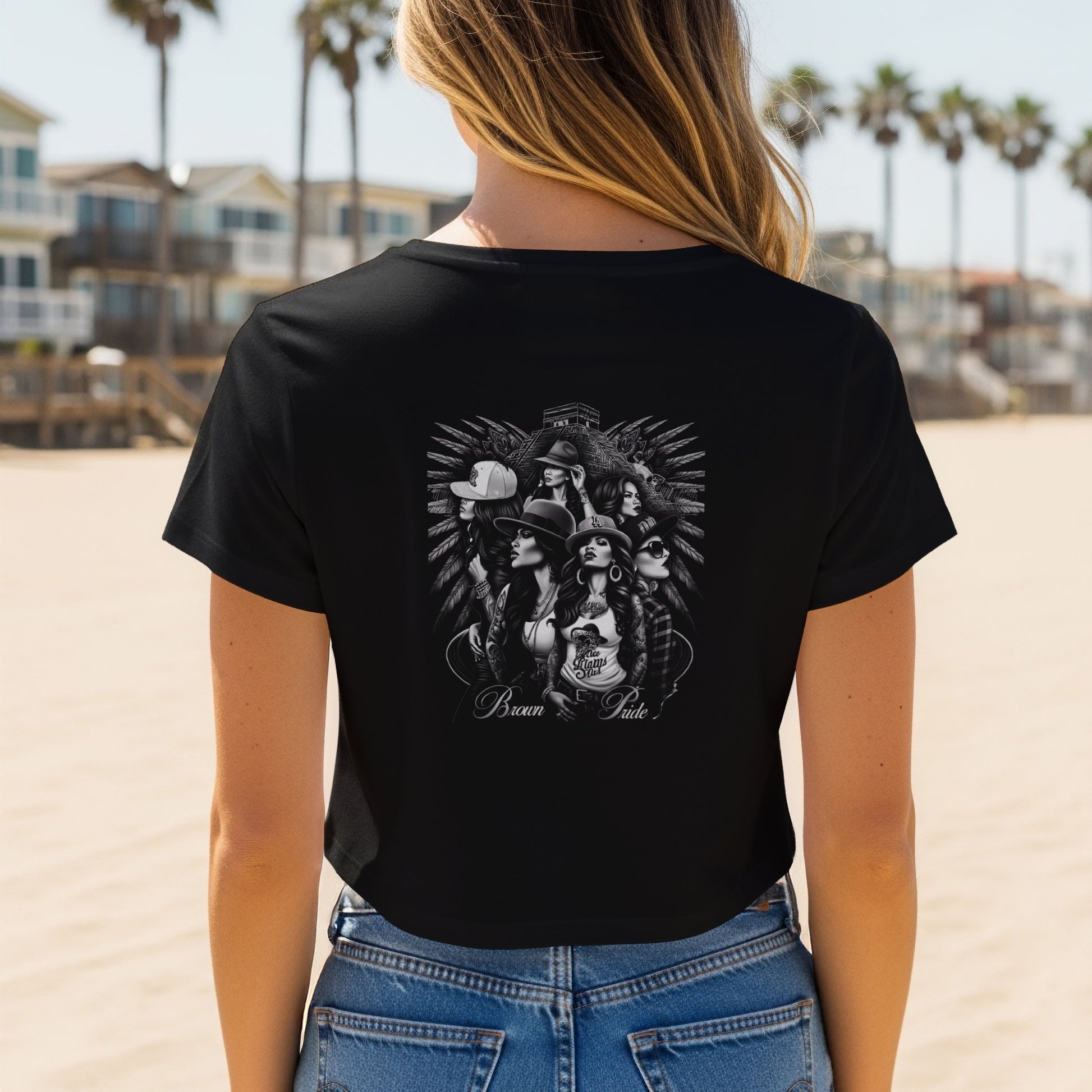 Black t-shirt graphic with "Brown Pride" text and portraits of women.
