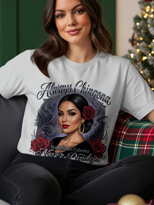 Woman wearing a white t-shirt with "Always Chingona Sometimes Pendeja" text and a woman's portrait.