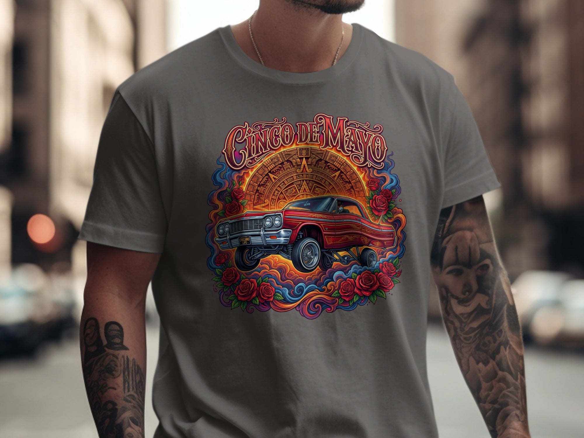 Cinco de Mayo graphic on grey t-shirt featuring classic red car and roses.