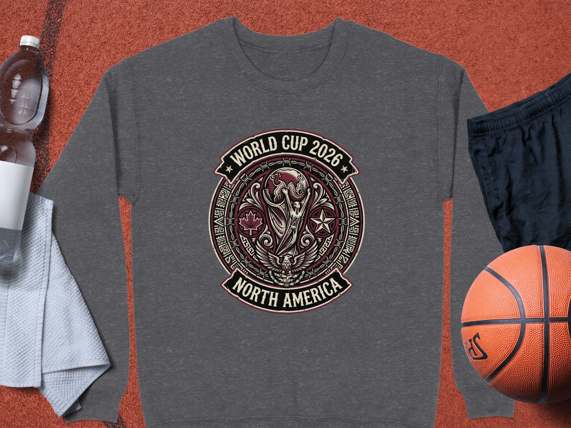 Grey sweatshirt with "World Cup 2026 North America" emblem, basketball, and water bottle.