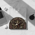 White t-shirt with Chicano eagle and snake graphic on a white surface.