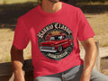 Red t-shirt with a graphic of a red classic pickup truck and text 