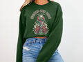 Green crewneck sweatshirt with World Cup 2026 North America trophy and roses design.