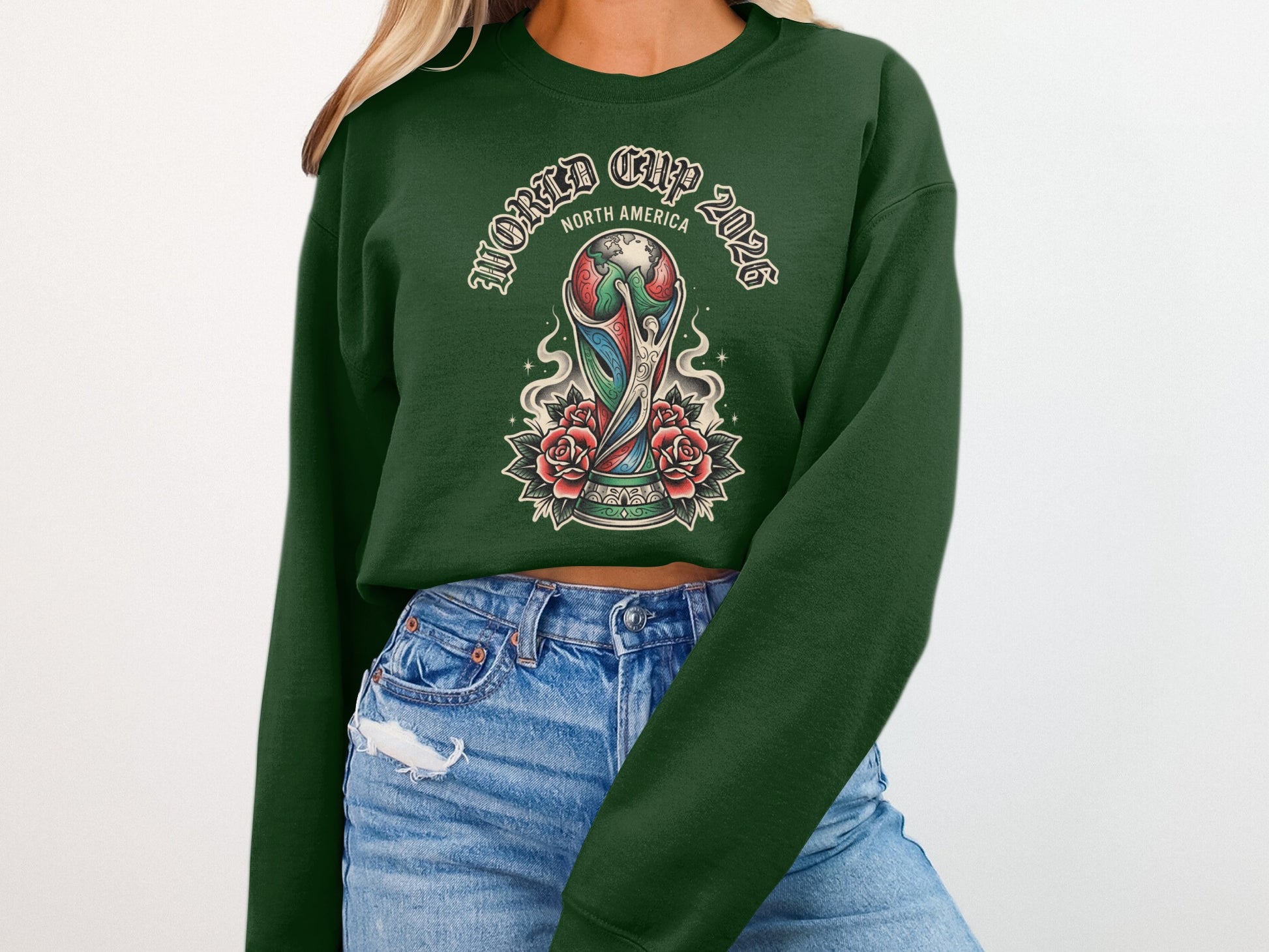 Green crewneck sweatshirt with World Cup 2026 North America trophy and roses design.