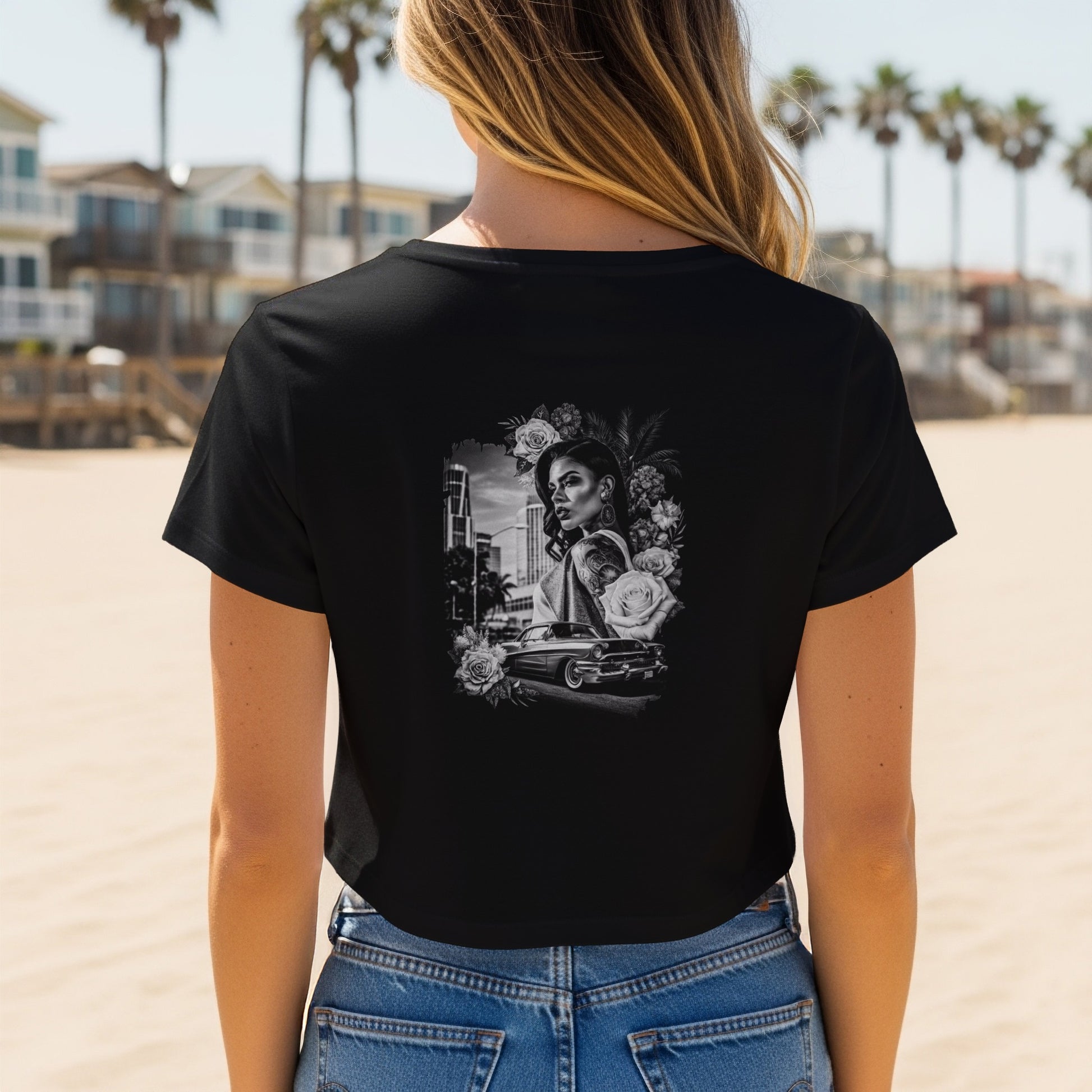 Black cropped t-shirt with grayscale tattoo-style graphic of a woman and vintage car.