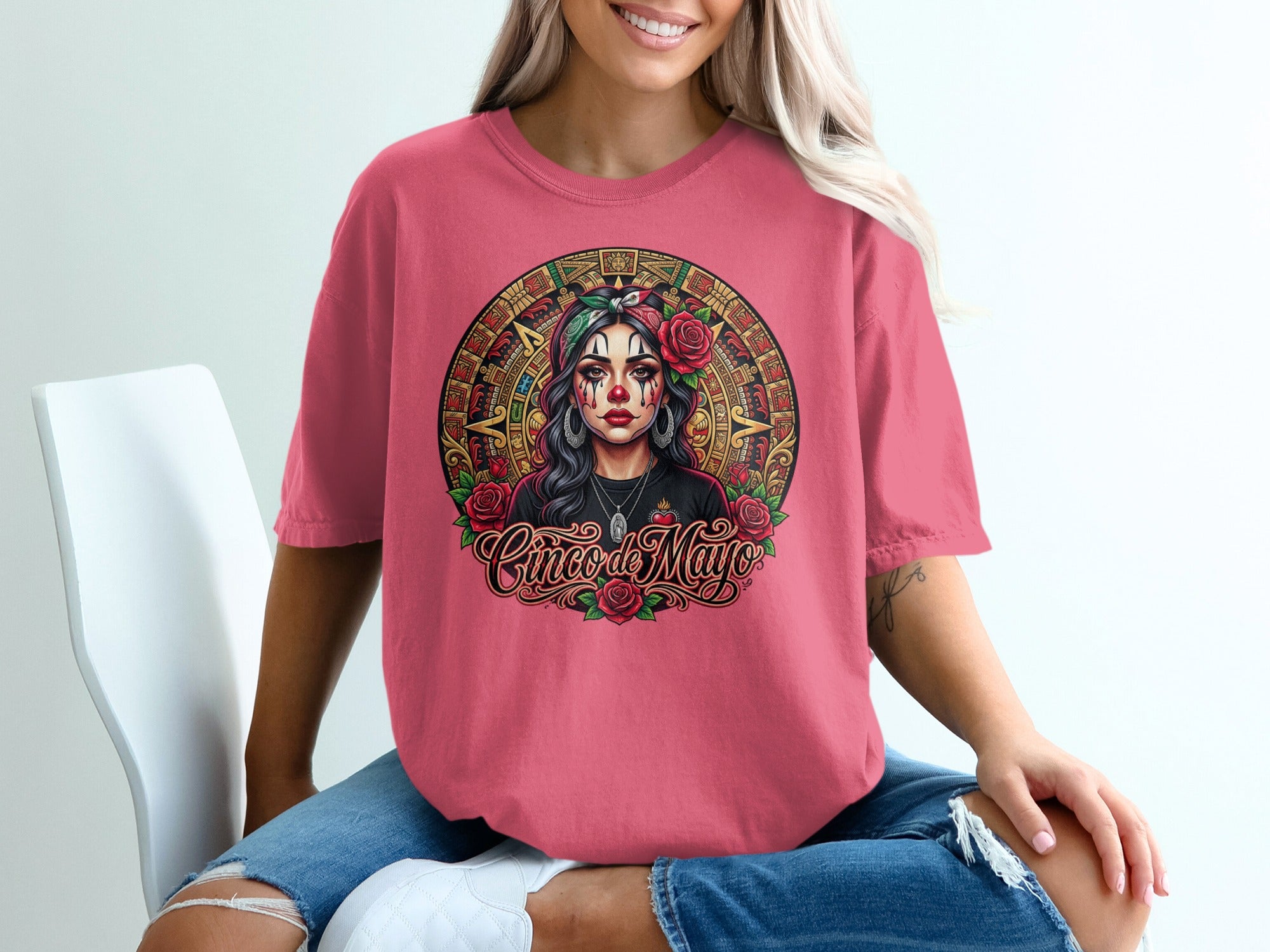 Woman in pink t-shirt with Cinco de Mayo skull graphic and roses.