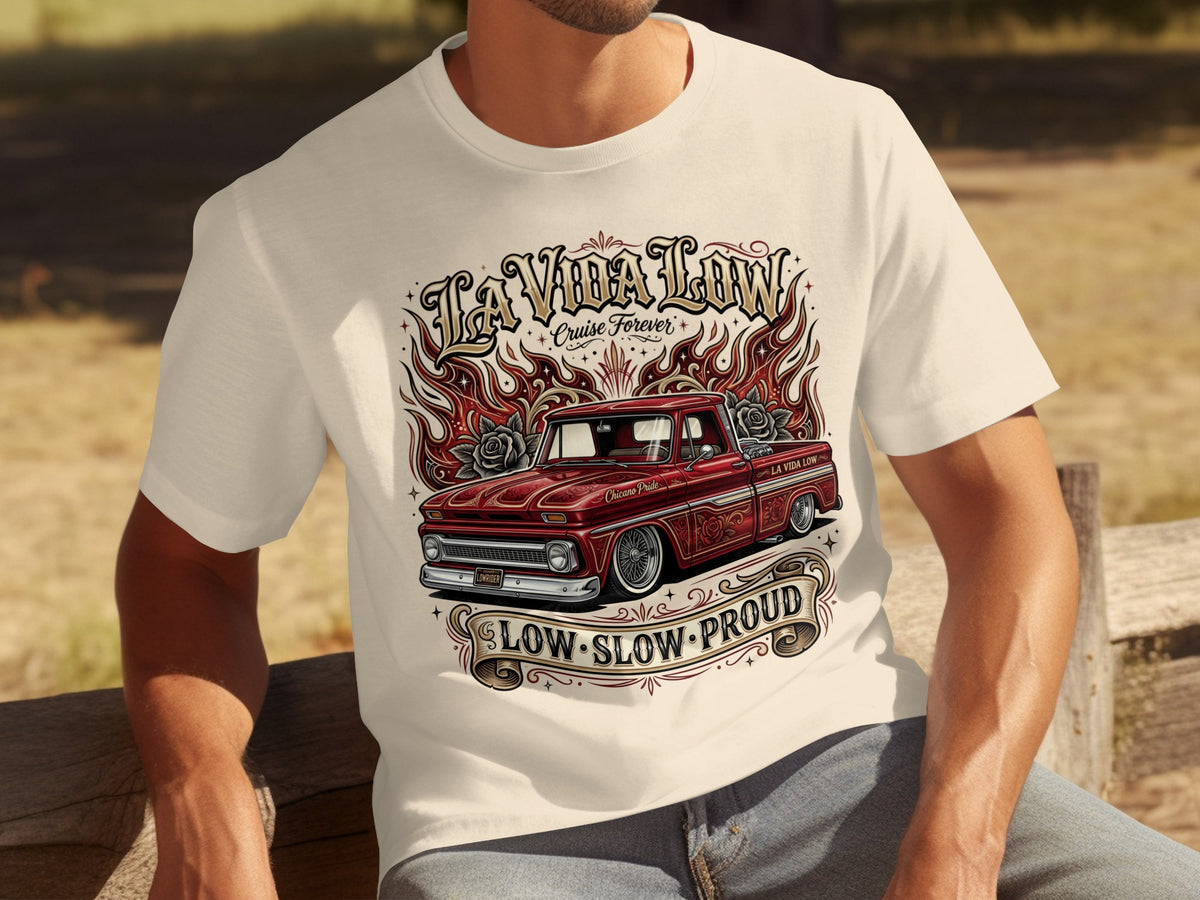 T-shirt graphic with red lowrider truck, flames, roses, and "La Vida Low" text.