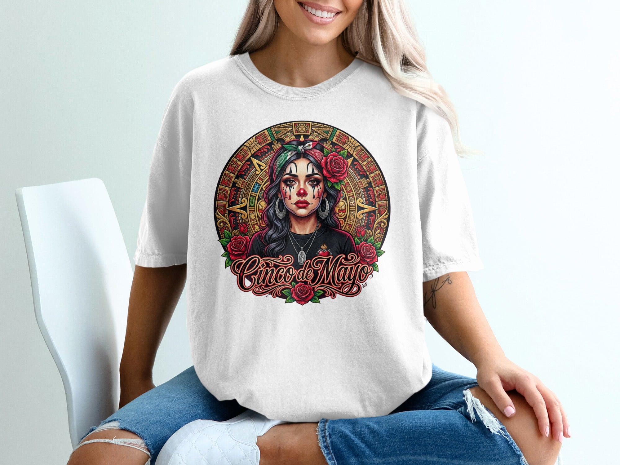 Woman in white t-shirt with Cinco de Mayo skull artwork and roses.