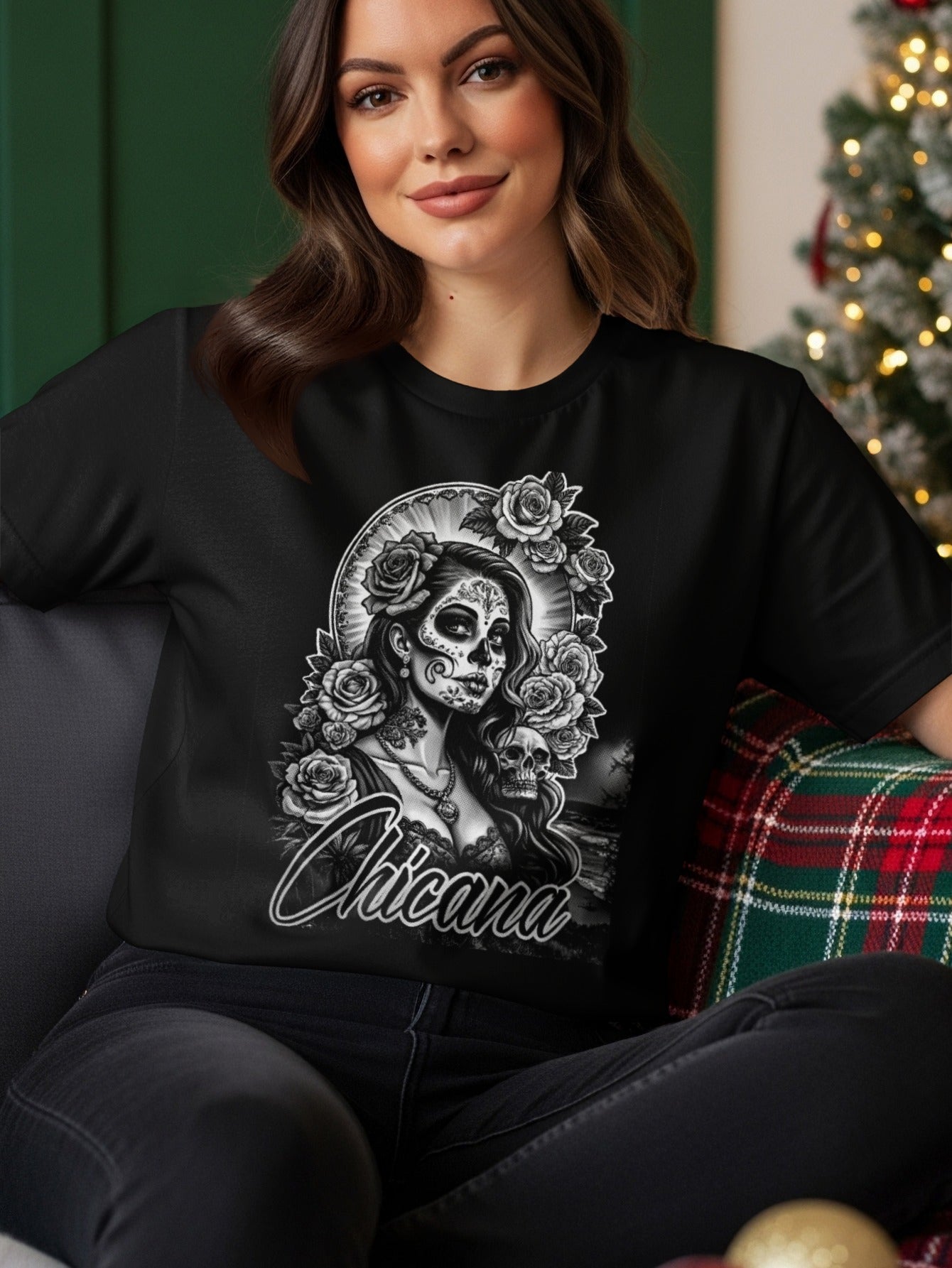 Woman wearing black t-shirt with Day of the Dead sugar skull girl graphic.
