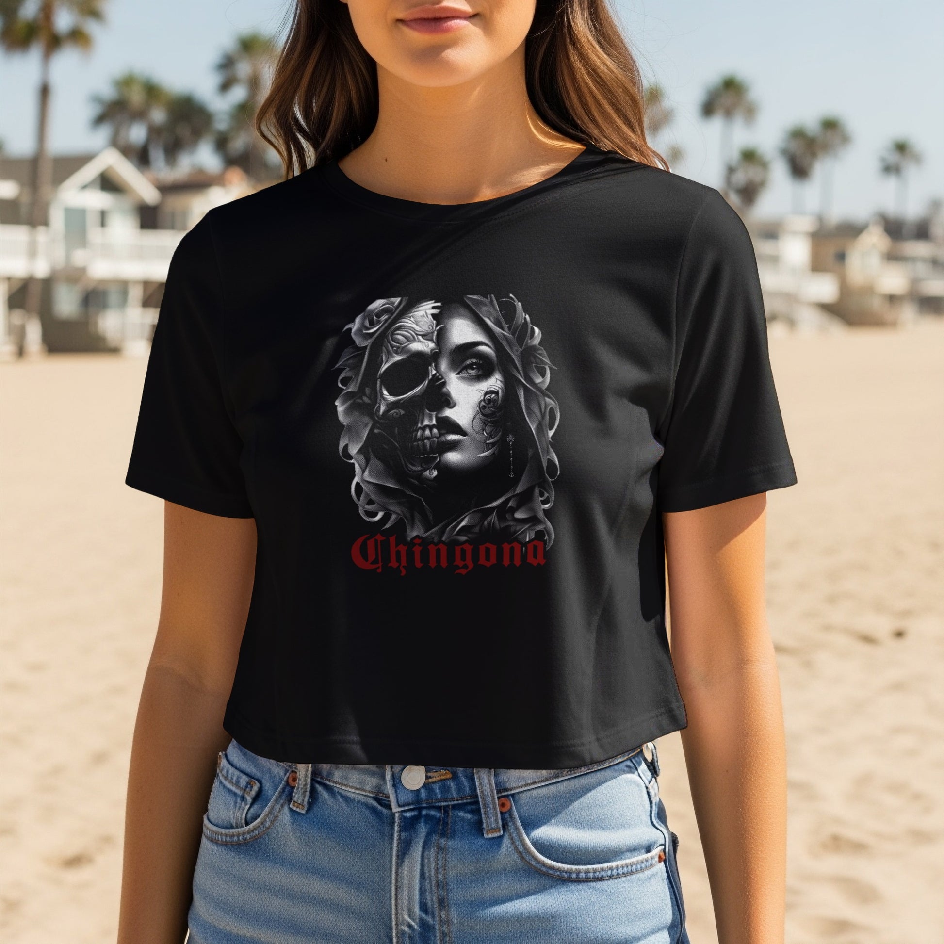 Black t-shirt with half skull and woman graphic, and "Chingona" text.