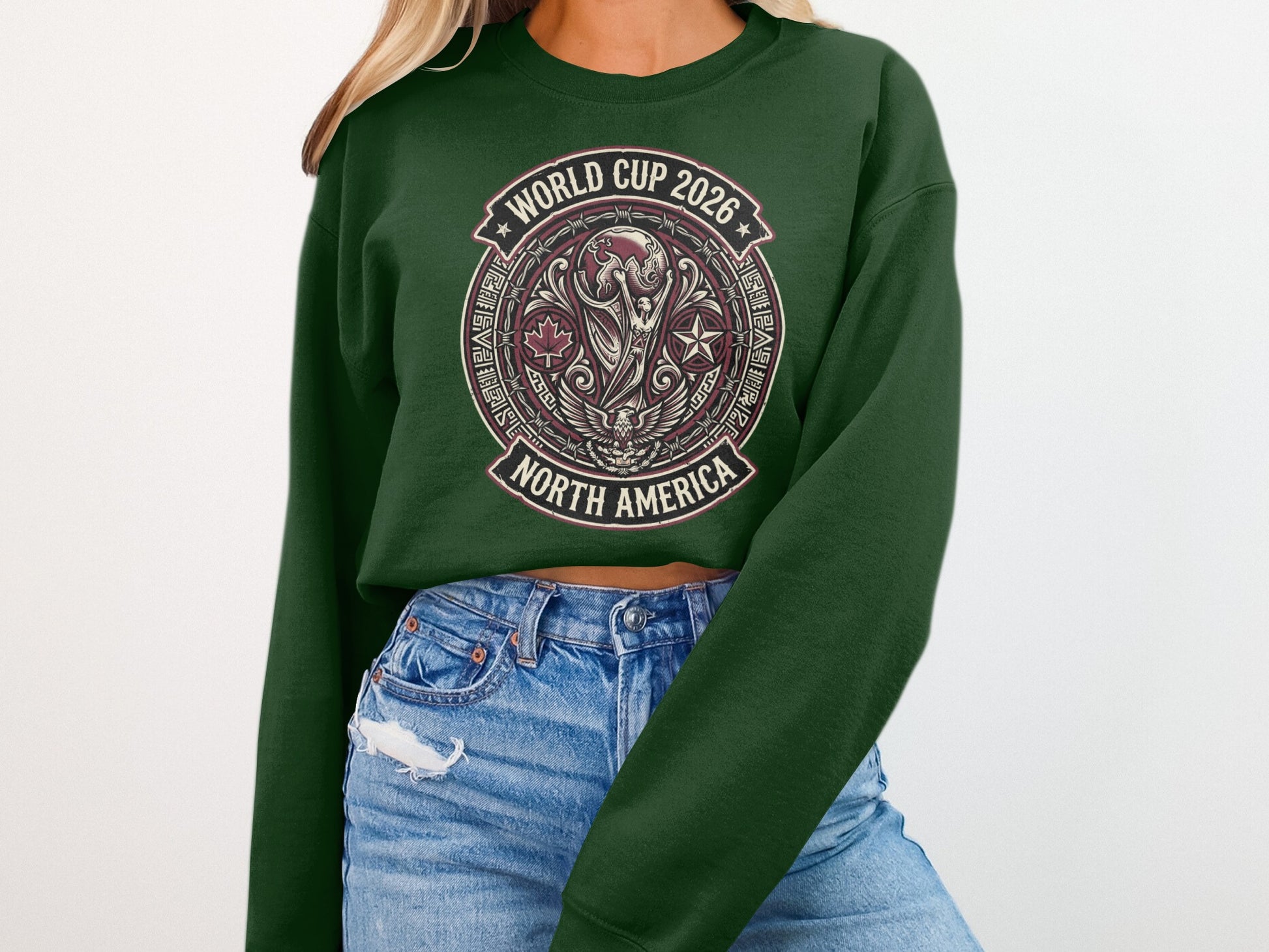Green crewneck sweatshirt with World Cup 2026 North America graphic.