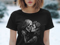T-shirt with sugar skull couple embrace, adorned with roses and tattoos.