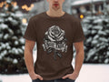 Brown t-shirt with a detailed black and white rose and banner that reads 