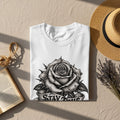 White t-shirt with a black and white rose graphic and 