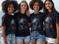 Four smiling women wear black t-shirts with a Jesus crown of thorns graphic.