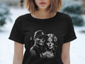 Black t-shirt with Day of the Dead inspired skull couple graphic.