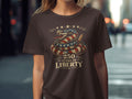 Brown t-shirt with coiled snake design and text 