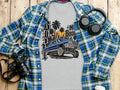 Grey t-shirt with a blue lowrider car and city skyline graphic.