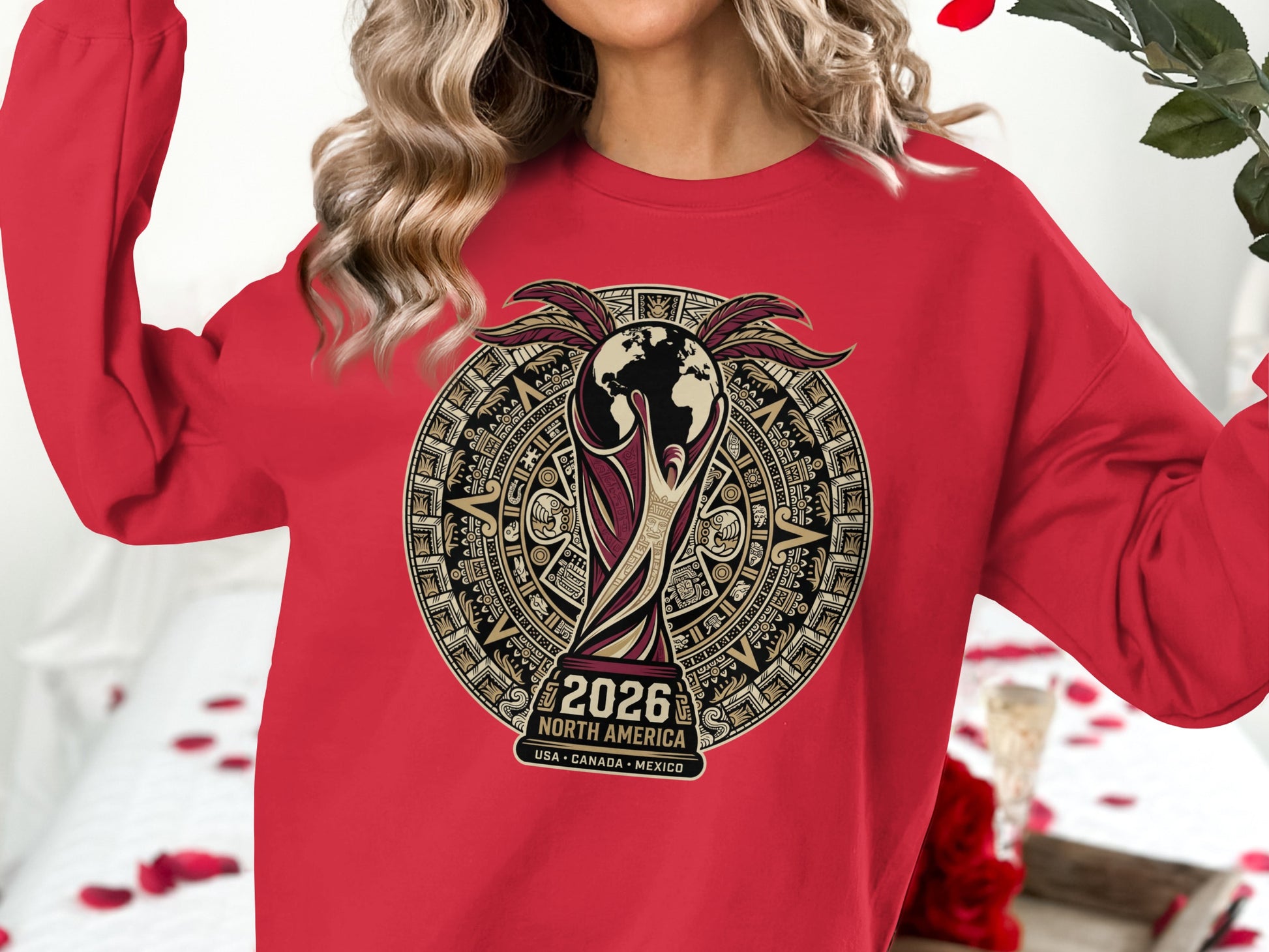 Red sweatshirt with 2026 World Cup graphic featuring globe and historical imagery.