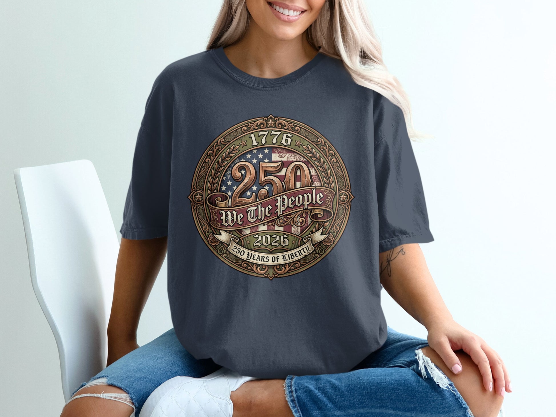Dark t-shirt with circular "1776 250 We The People 2026 250 Years of Liberty" graphic.