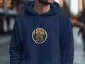 Navy hoodie with circular patch featuring a camper van and mountains.