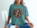 Chicano Brown Pride All Star eagle and star graphic on teal t-shirt.