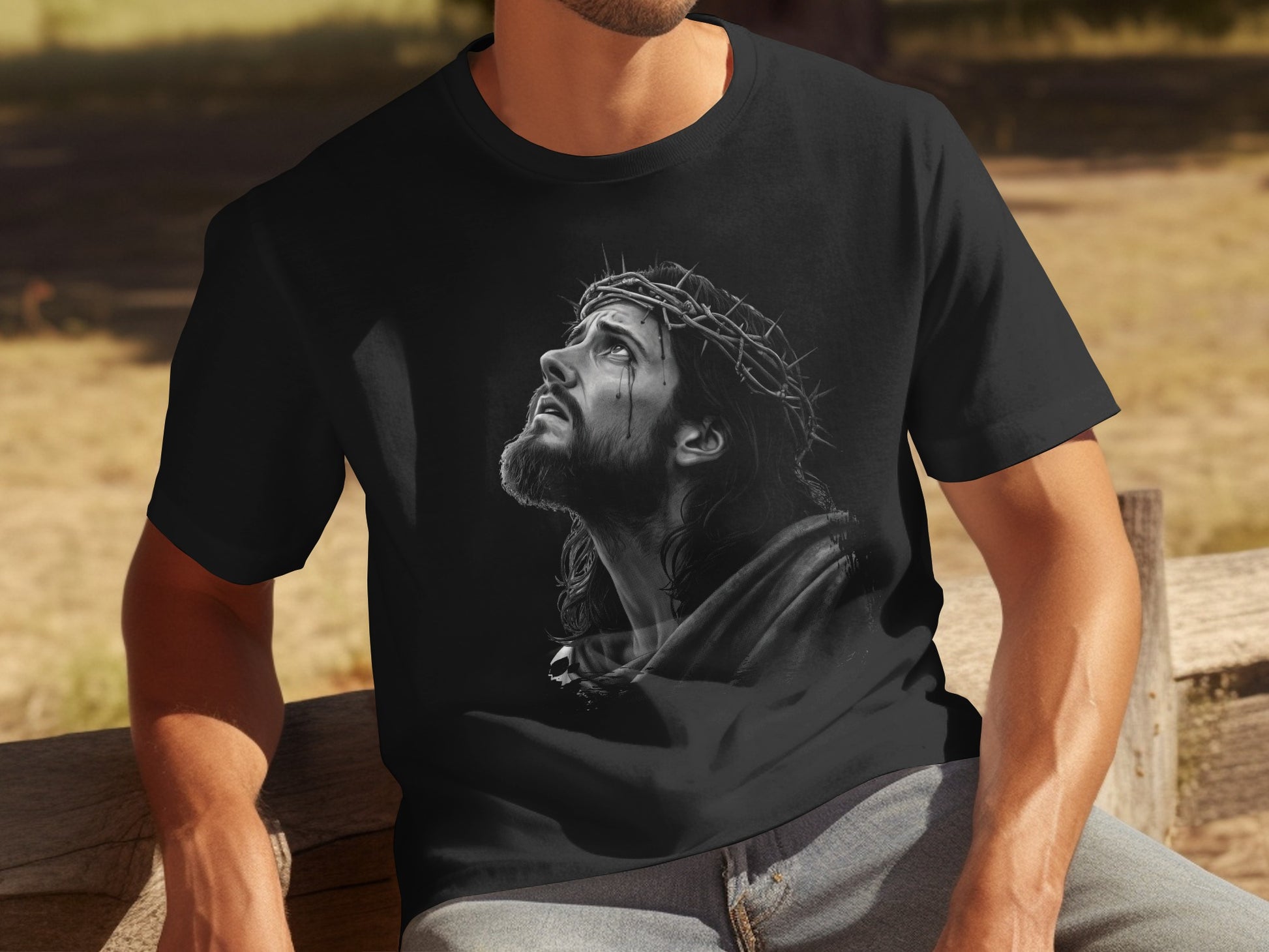 Black t-shirt featuring a charcoal drawing of Jesus Christ with a crown of thorns.