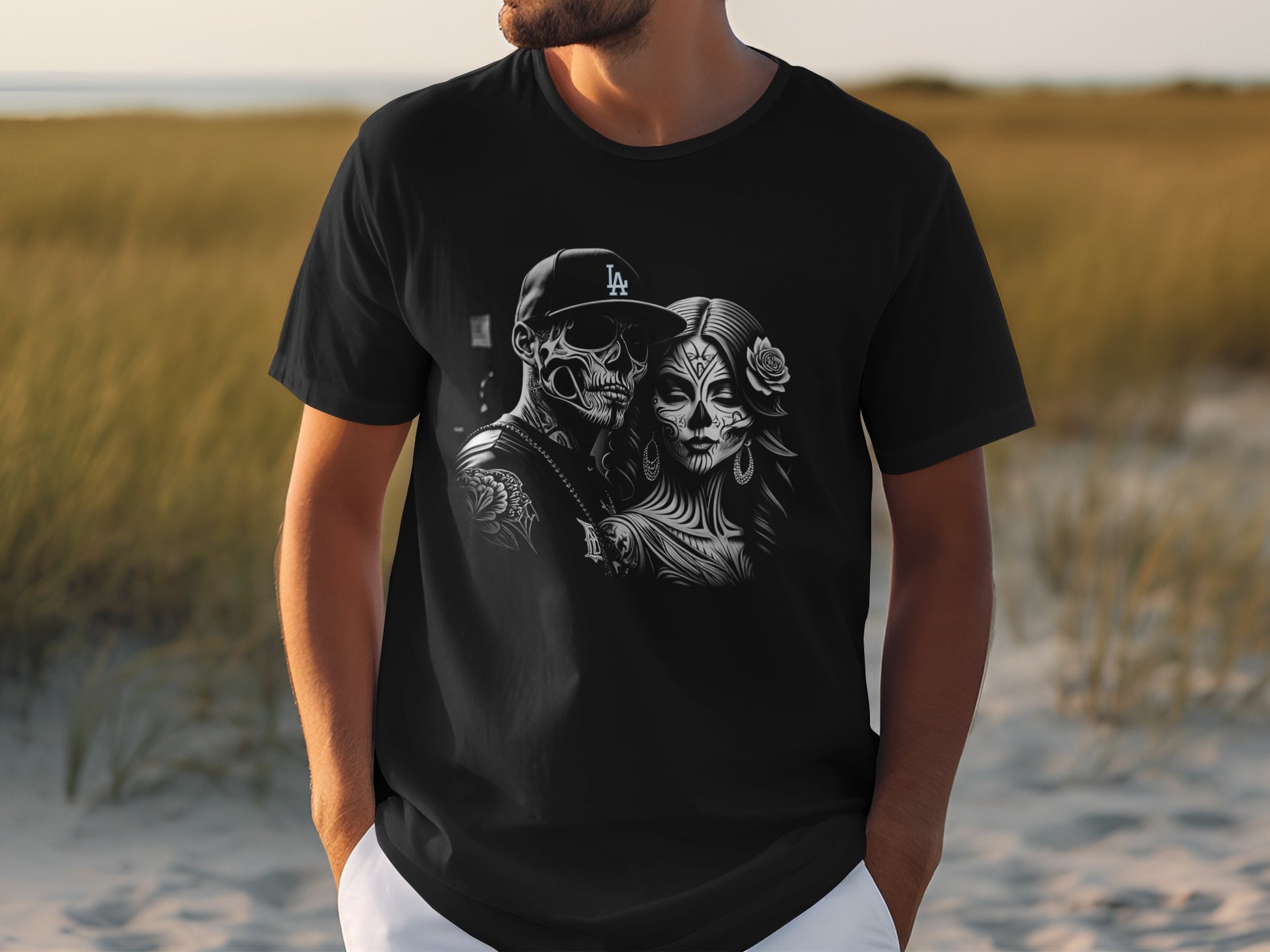 Black t-shirt featuring a skull couple with LA baseball cap and floral skull makeup.