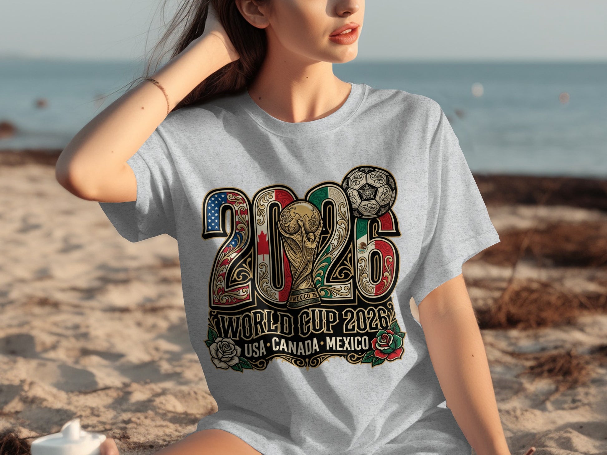 T-shirt with 2026 World Cup USA, Canada, Mexico logo featuring flags and soccer ball.