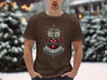 Brown t-shirt with a graphic of a thorny heart, cross, roses, and 