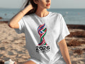 Woman wearing a white t-shirt with the 2026 World Cup logo and text.
