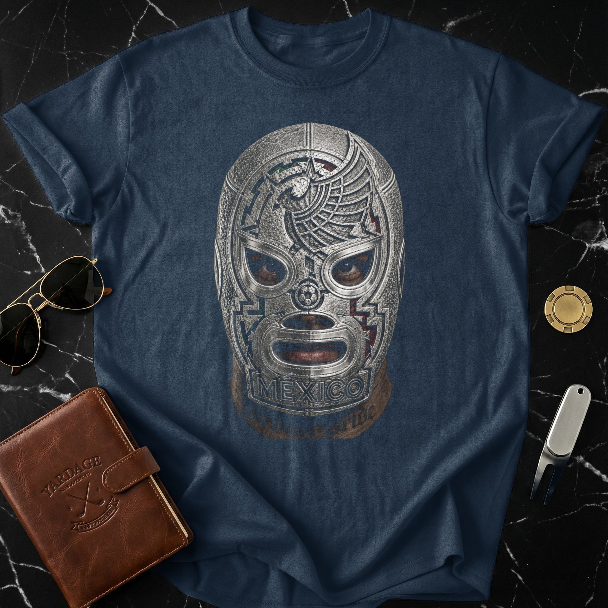 Dark blue t-shirt featuring a close-up of a silver lucha libre wrestling mask.