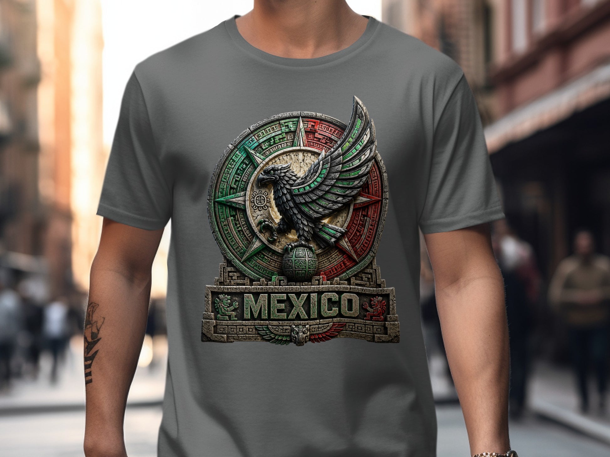 Grey t-shirt with Mexican eagle emblem and "MEXICO" text on textured background.