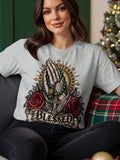 Grey t-shirt with praying hands, rosary, crucifix, roses, and the word BLESSED.